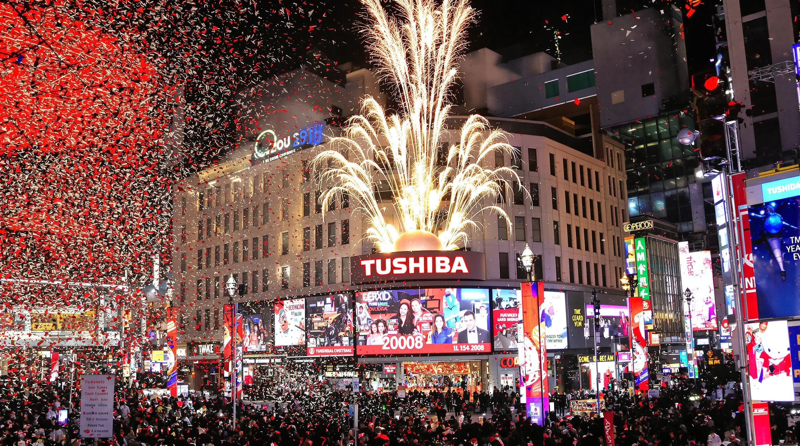 Times Square ball drop New Year’s Eve countdown to 2008 Toshiba countdown clock with popping colorful confetti machine and fireworks