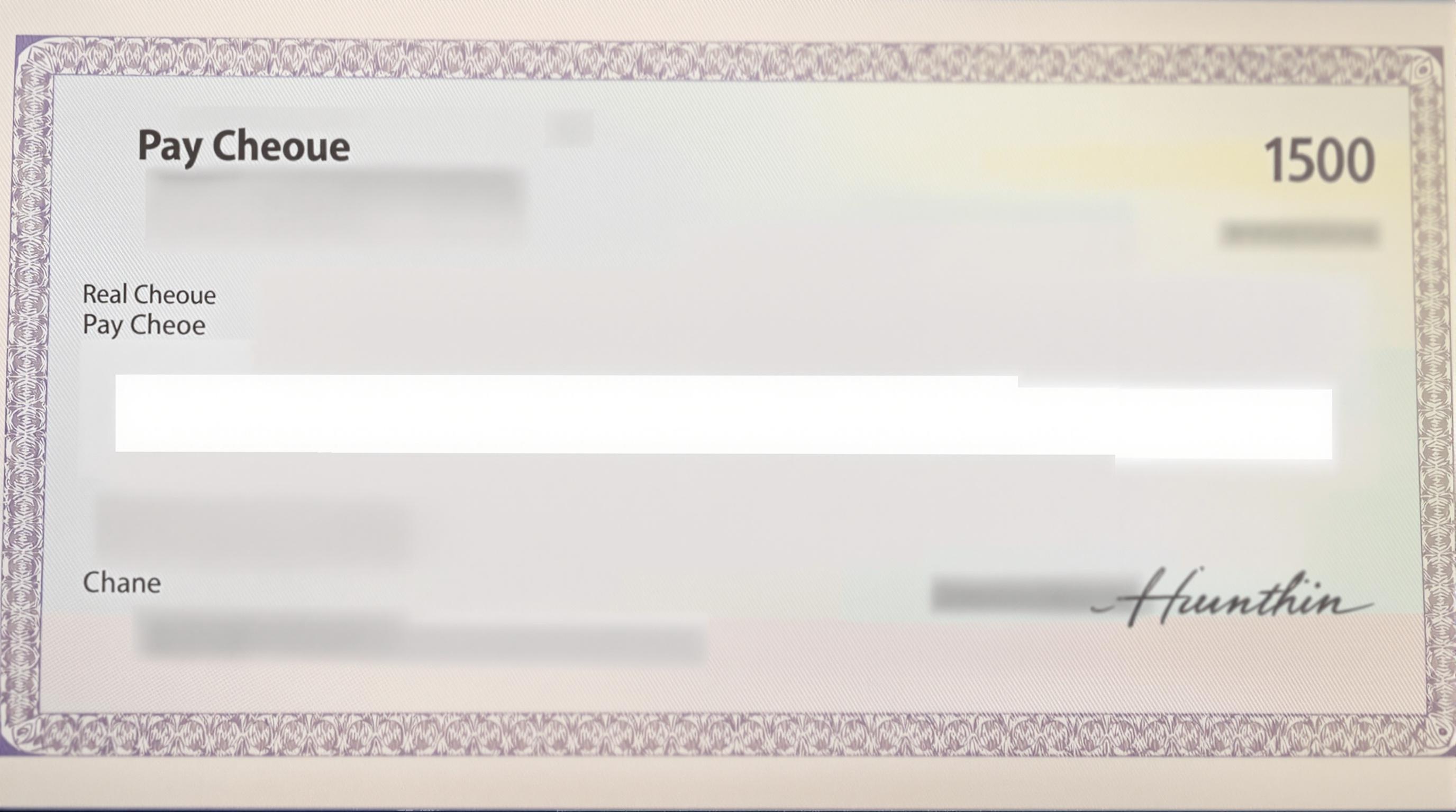 Realistic Pay Cheque Image Image of a realistic pay cheque with blurred out details.